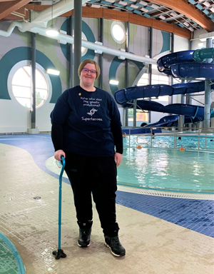 Alexis Holmgren standing inside on the Dawe pool deck