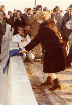 Ethel Taylor cutting the ribbon at the opening of Taylor Bridge